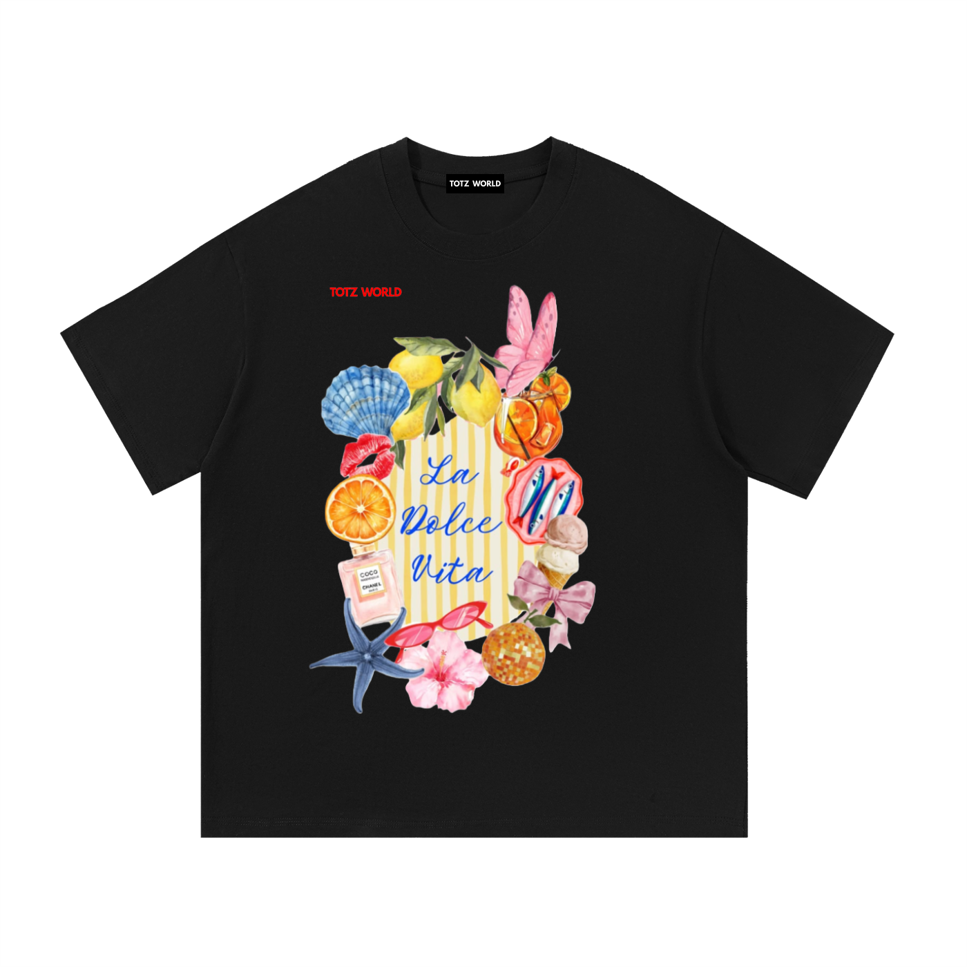 A black short-sleeve crewneck t-shirt by TOTZ World, featuring a colorful beach-themed graphic print on the front with the text 'La Dolce Vita' and illustrations of a striped beach bag, pink butterfly, starfish, seashells, and citrus fruits.