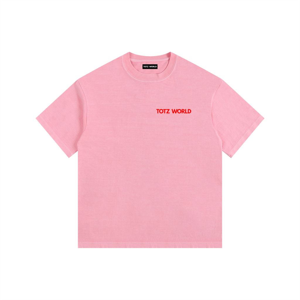 A light pink short-sleeve crewneck t-shirt with 'TOTZ WORLD' printed in red across the chest, displayed flat against a solid white background.