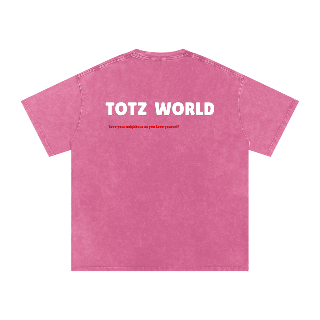 A pink short-sleeve t-shirt with a Snow-wash texture, featuring the words 'TOTZ WORLD' in bold white letters and a smaller red slogan underneath, displayed on a clean white background.